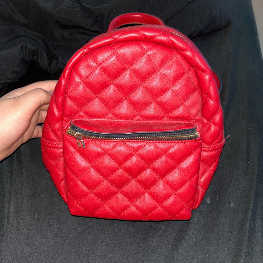 Red nice size woman’s backpack purse
